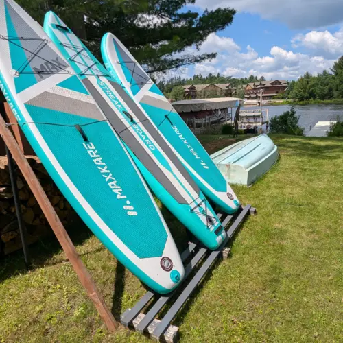Alt: Experience the Northwoods from the water with our on-site canoes and kayaks, offering fun lake adventures for the whole family at our vacation rental.